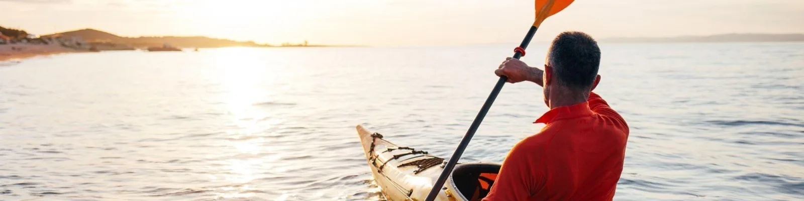 Man paddling in canoe